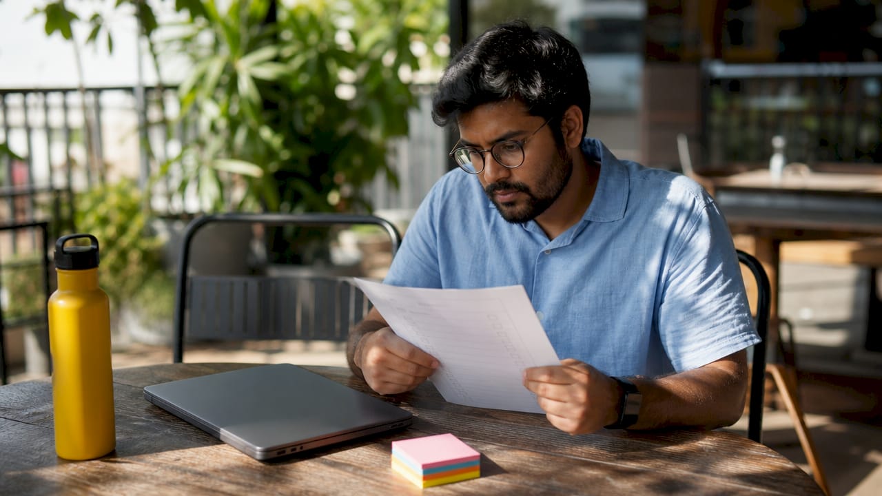 Engineer reviewing structured bug report checklist