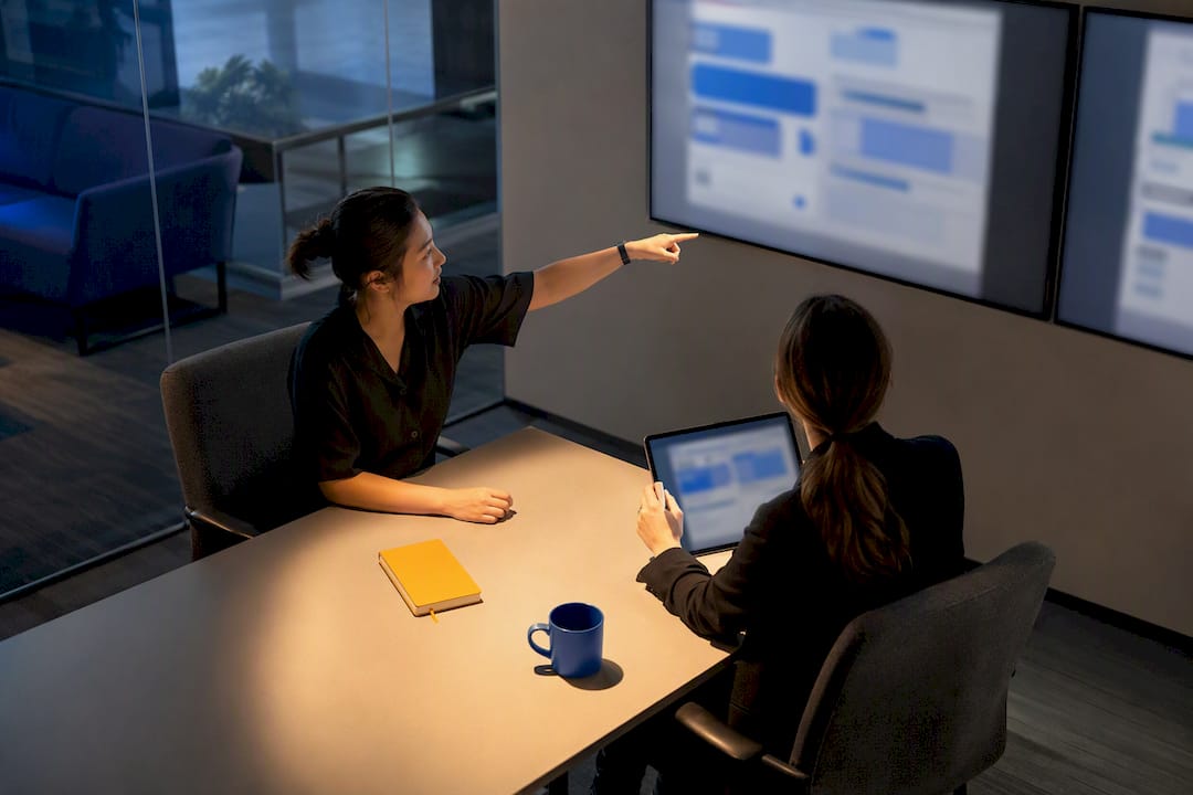 QA analysts reviewing duplicate bug clusters