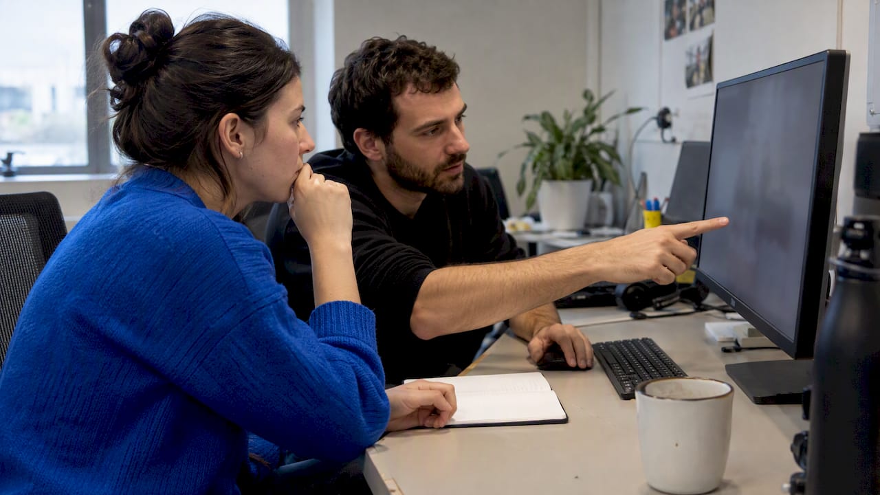 UAT testers comparing duplicate issue reports