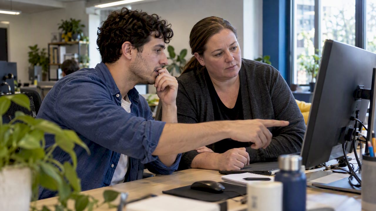 UAT tester and analyst reviewing a feature