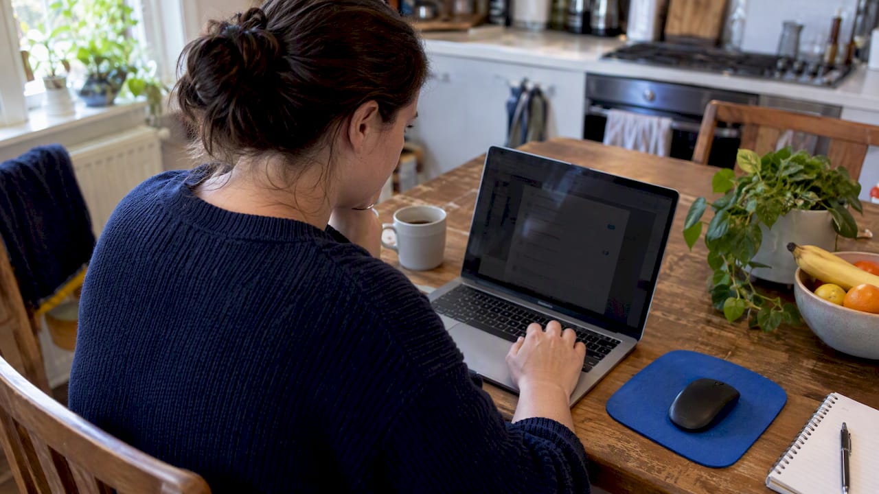 User checking microphone permissions on laptop