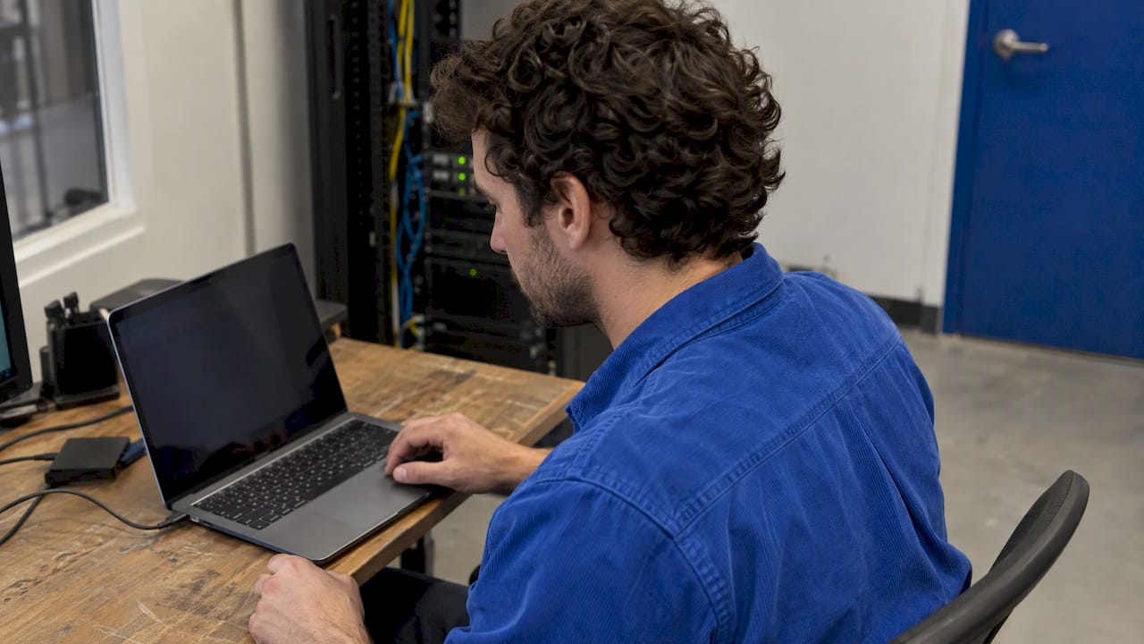 Tester configuring a SCIM endpoint on laptop